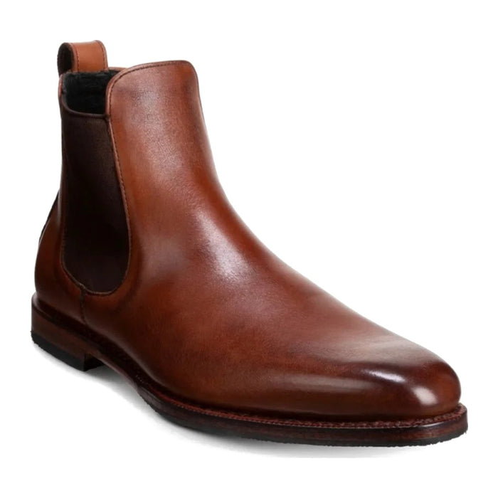 Men's brown leather Chelsea boot with elastic side panel on white background