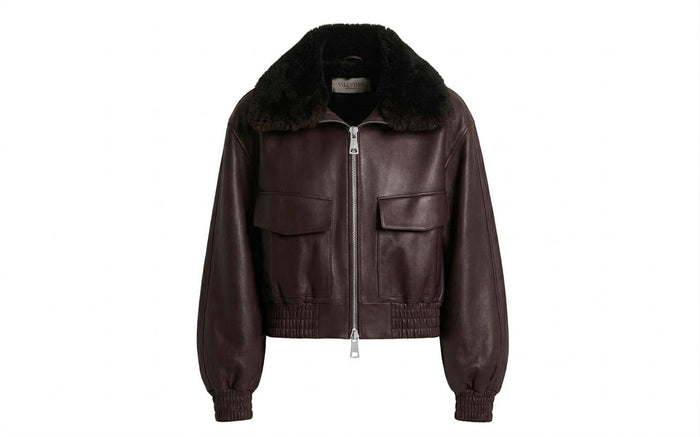 Brown cowhide leather aviator jacket with faux fur collar on white background