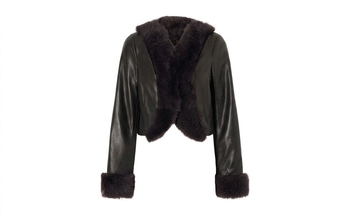 Women's cropped cowhide leather moto jacket with fur collar on white background