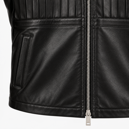 Close-up of zip pocket and pintuck stitching on black cowhide leather jacket
