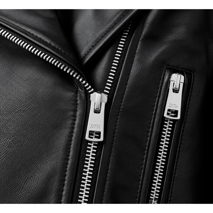 Close-up of asymmetric zip and zip pocket on black leather jacket