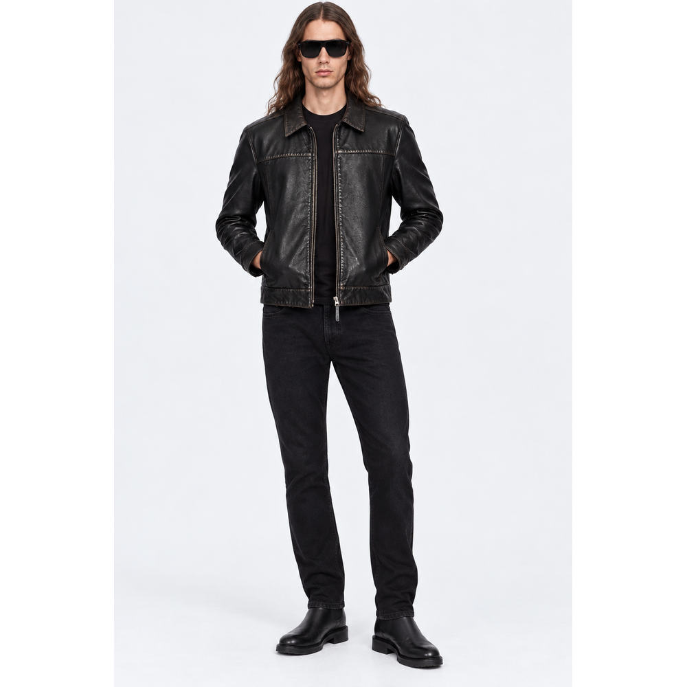 Man wearing a black cowhide leather jacket with black jeans