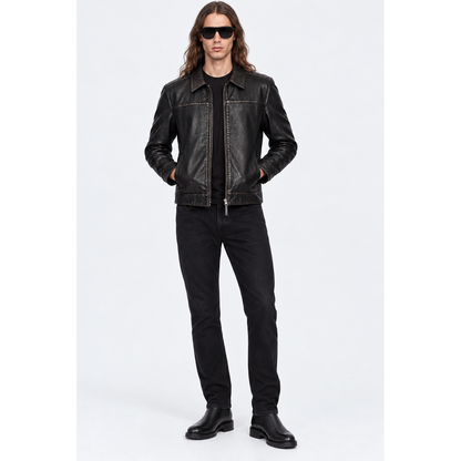 Man wearing a black cowhide leather jacket with black jeans