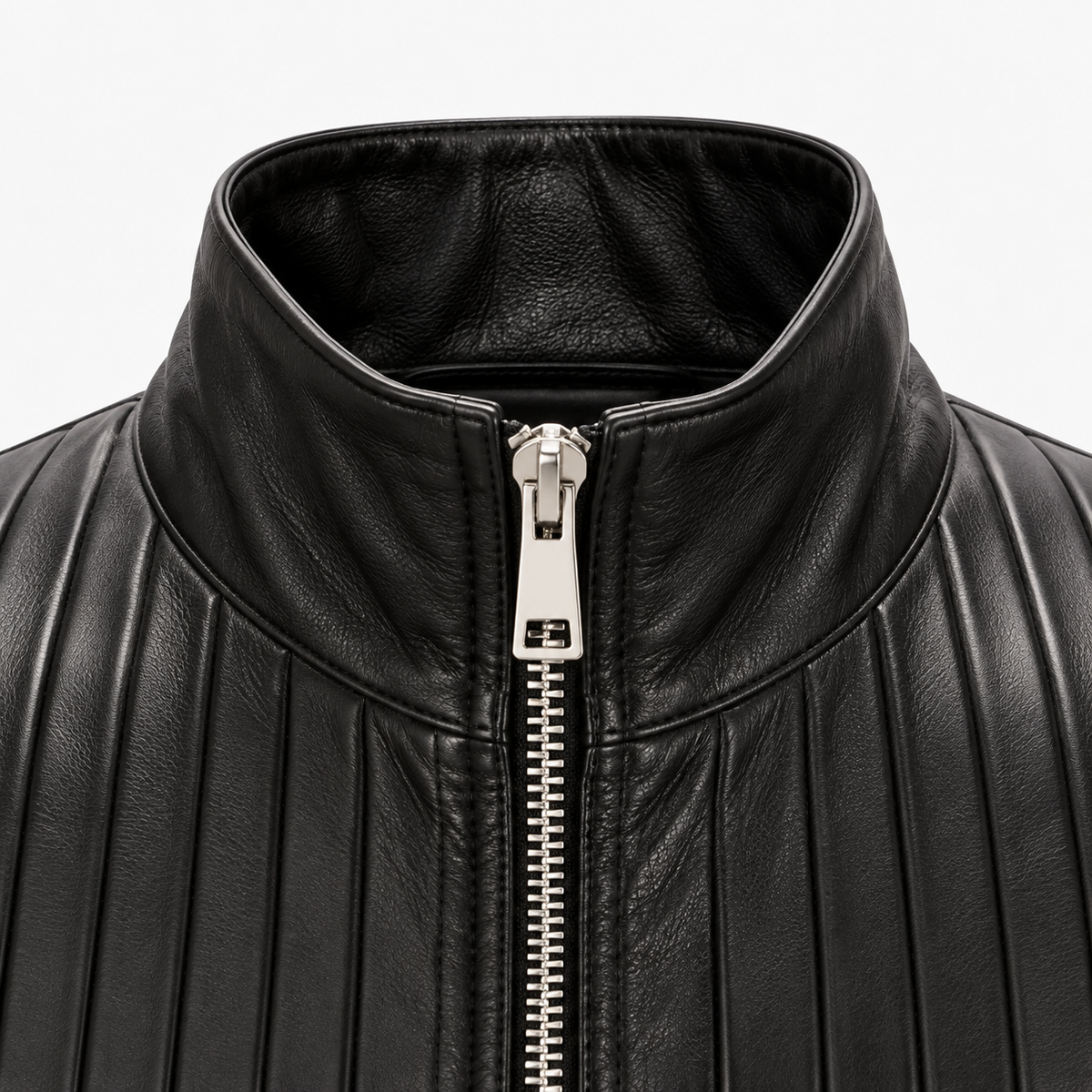 Close-up of stand collar and silver zip on black pintuck leather jacket