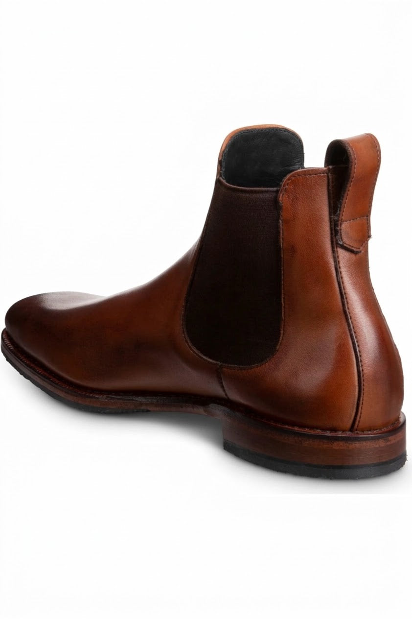Three-quarter view of cognac leather Chelsea boot