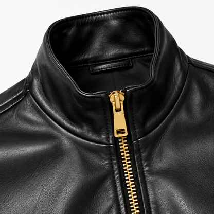 Close-up of stand collar and chunky gold zip on black leather jacket