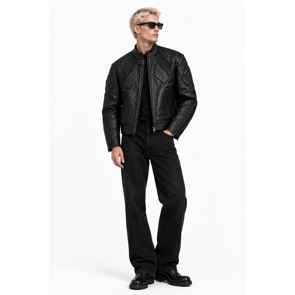 Man wearing black embossed leather moto jacket with black trousers