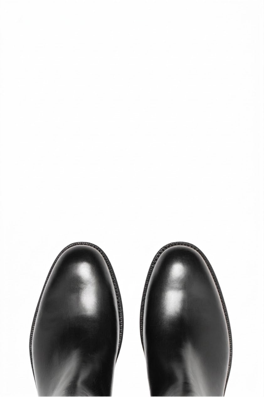 Top view of pair of black leather Chelsea boots