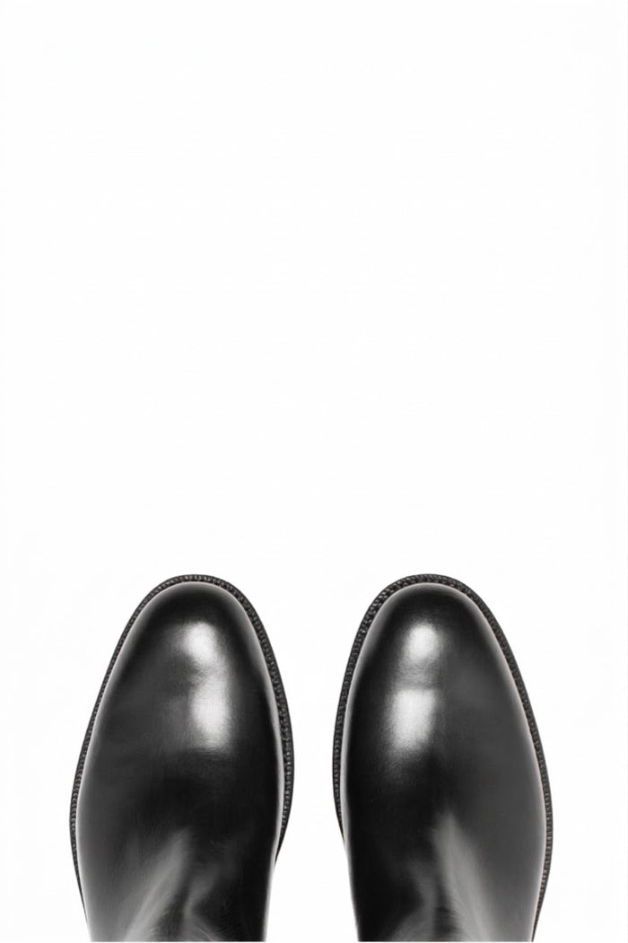 Top view of pair of black leather Chelsea boots
