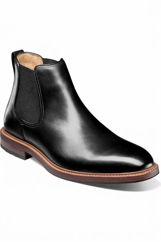 Men's black leather Chelsea boot with contrast brown sole, side view