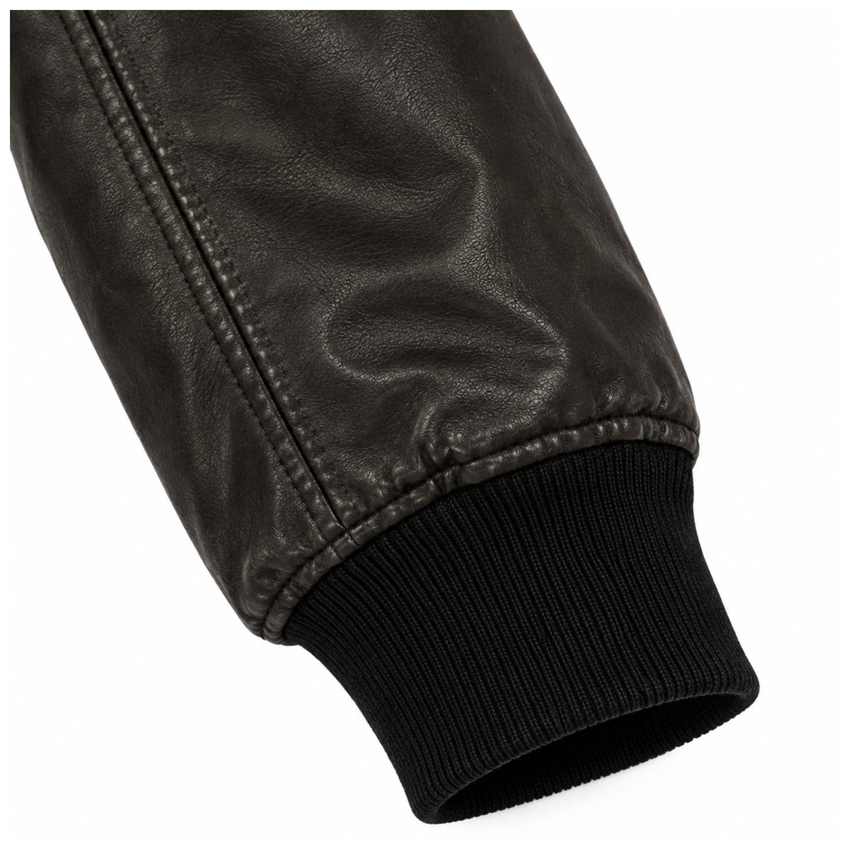 Close-up of ribbed cuff on men's black leather bomber jacket sleeve