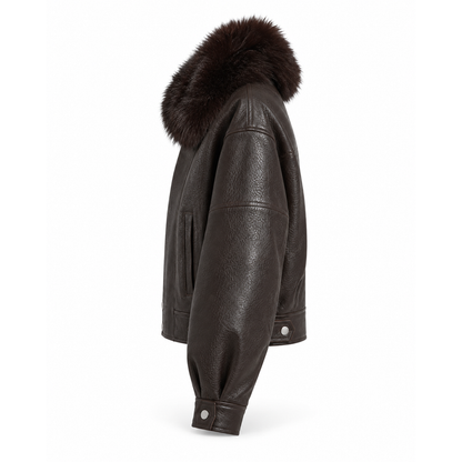 Side view of women's brown leather aviator jacket with fur collar