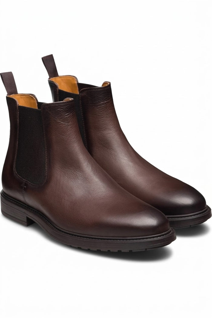 Pair of men's dark brown leather Chelsea boots with lug soles
