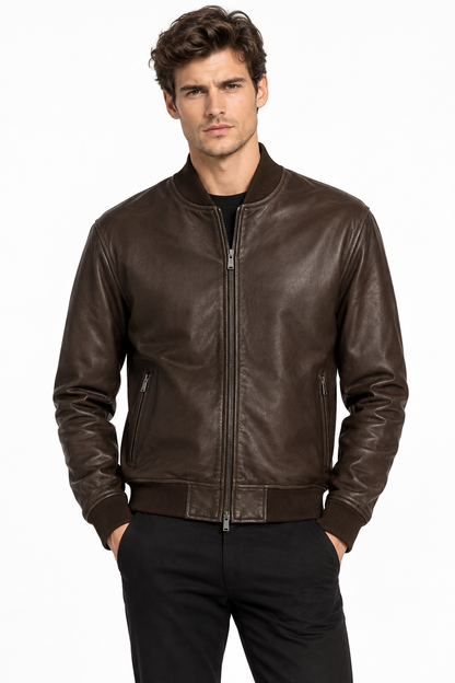 Man wearing a dark brown leather bomber jacket with black jeans
