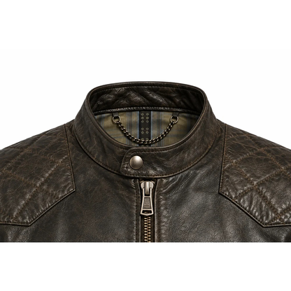 Close-up of snap-tab band collar and quilted shoulder on cafe racer jacket