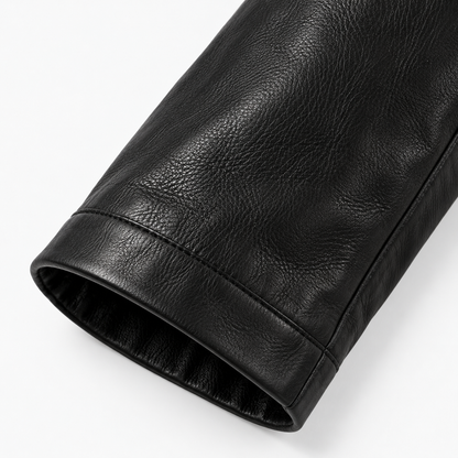 Close-up of ribbed cuff on men's black leather bomber jacket