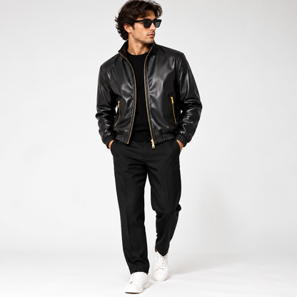 Man wearing black pintuck cowhide leather bomber jacket with black trousers