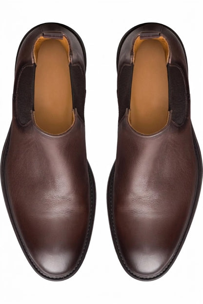 Top view of pair of dark brown leather Chelsea boots