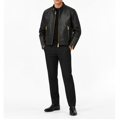 Man wearing black leather jacket with gold zips and black trousers