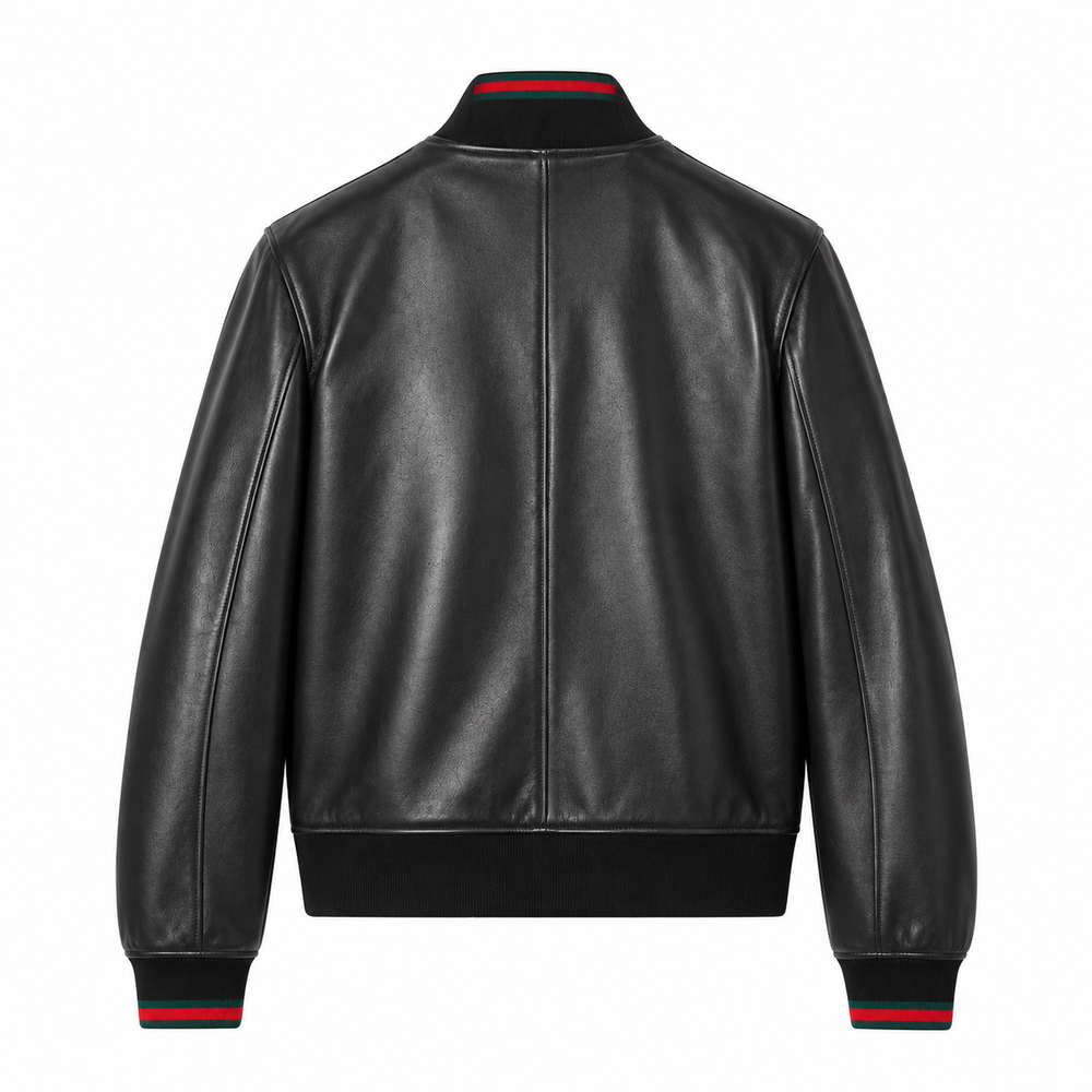Back view of black leather bomber jacket with red-tipped ribbed cuffs and hem