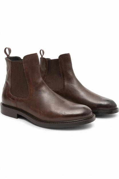 Pair of men's brown leather Chelsea boots with chunky soles