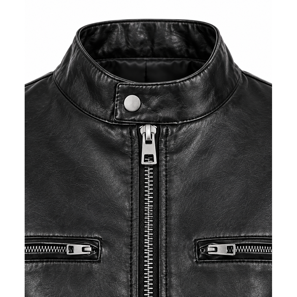 Close-up of front zip and zip chest pockets on women's black leather jacket