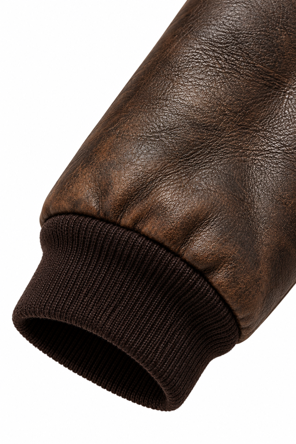 Close-up of ribbed cuff on distressed brown leather bomber sleeve